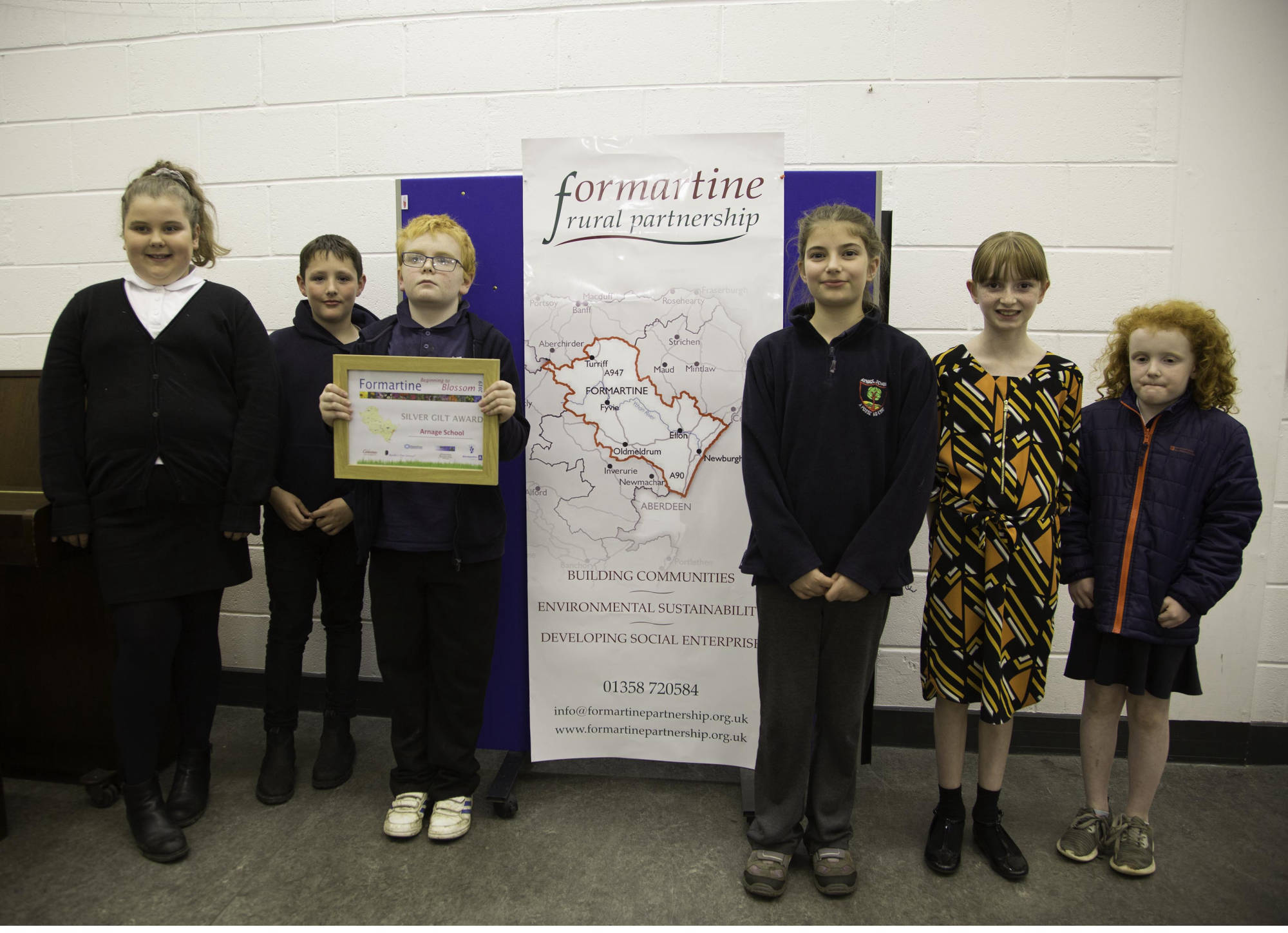 Silver gilt award - Arnage School receiving their award